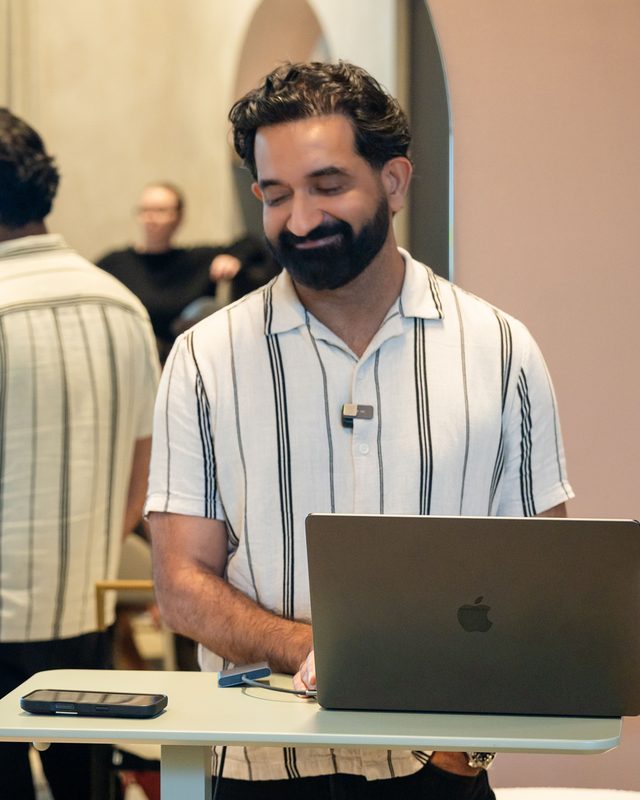 Bodhi Bijlani building at a laptop during the masterclass